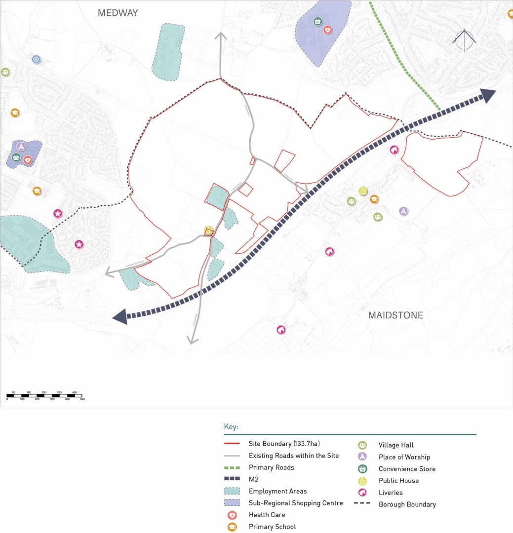 Map of a site boundary spanning Medway and Maidstone, with main and existing internal roads, the M2 motorway crossing diagonally, employment areas, shopping centres, and various community facilities marked with icons.